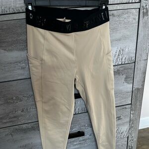 Free people movement leggings tan color NWOT. Size S